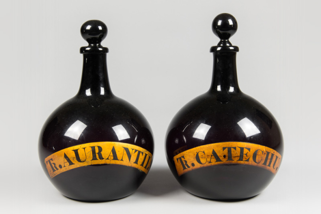 Rare pair of early 19th century English blue glass apothecary carboy bottles. Price realised £1,750.