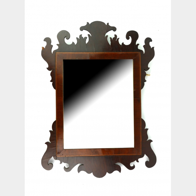 AN EARLY 19TH CENTURY MAHOGANY AND BEVELLED GLASS MIRROR