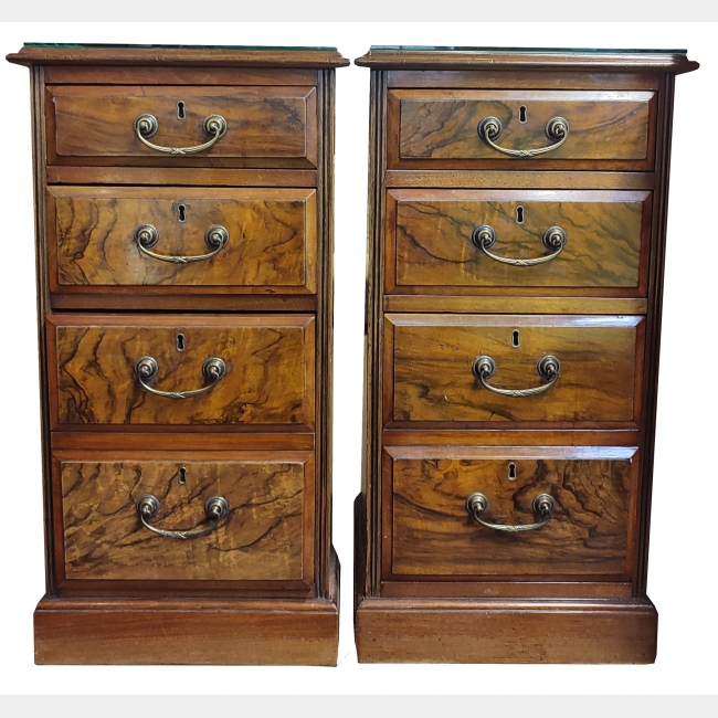 A PAIR OF EARLY 20TH CENTURY FIGURED WALNUT PEDESTAL CHEST OF DRAWERS
