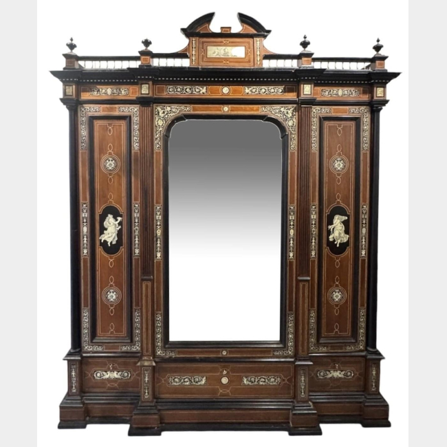 ATTRIBUTED TO FERDINANDO POGLIANI, 1832 - 1899, A LARGE AND IMPRESSIVE 19TH CENTURY ITALIAN RENAISSANCE BREAKFRONT EBONISED AND IVORY INLAID ARMOIRE/ WARDROBE
