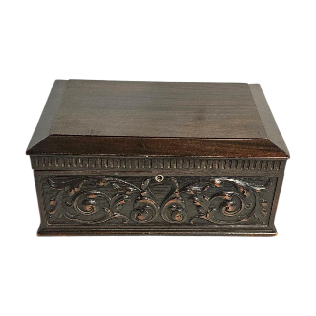 A Victorian style carved mahogany casket